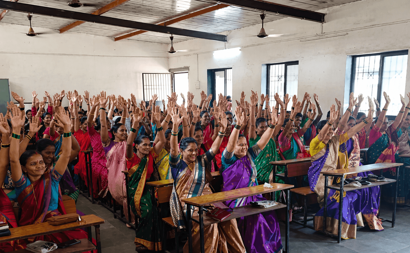 Children and women in a warm community gathering